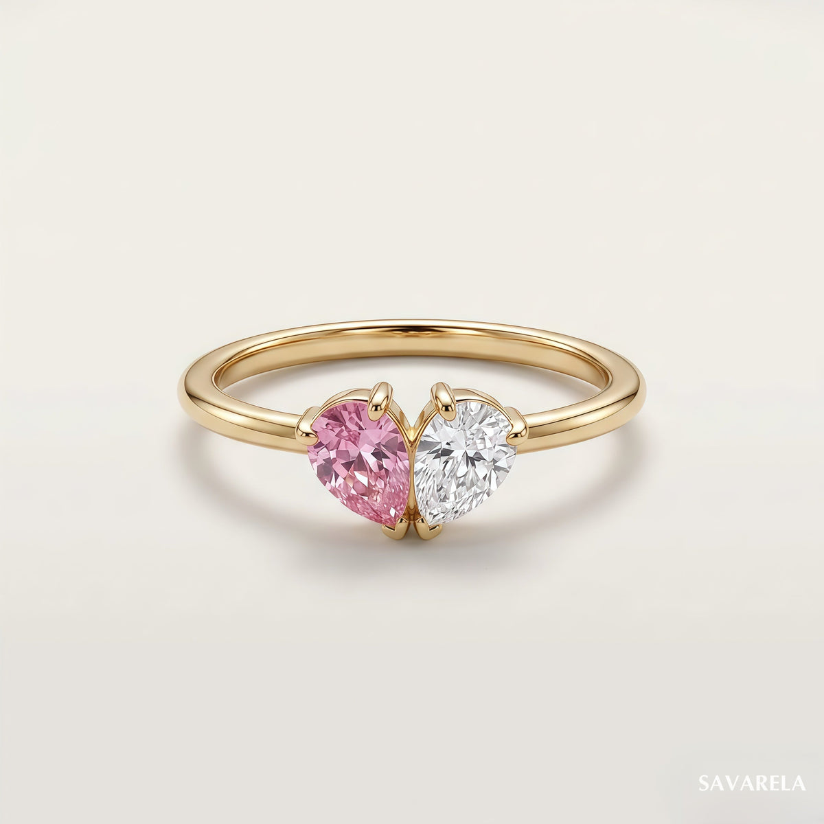 Elora ring in 18k gold with two teardrop birthstones forming a heart