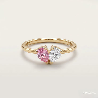 Elora ring in 18k gold with two teardrop birthstones forming a heart
