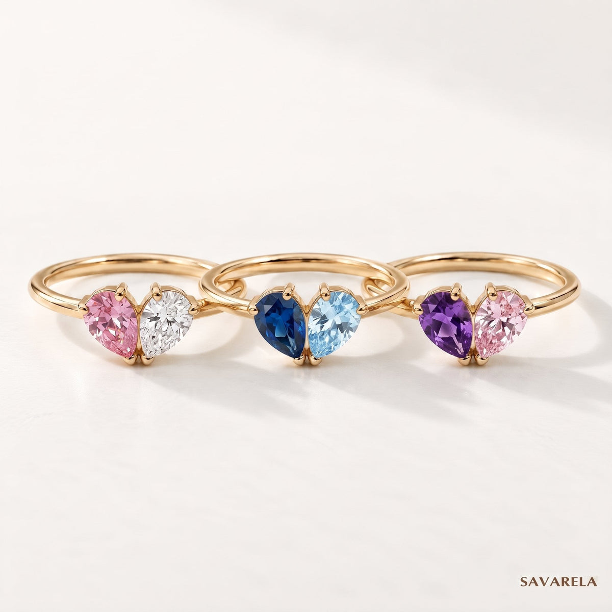 Three Elora rings with different birthstones