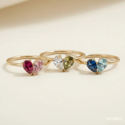 Three Elora rings with different birthstones