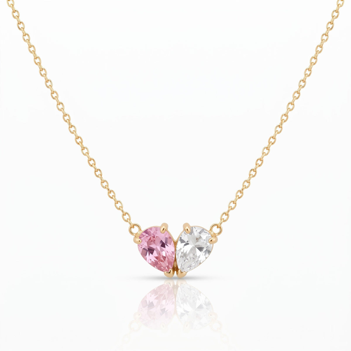 Elora Necklace in gold with a pink and a white birthstone forming a heart