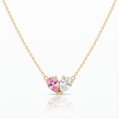 Elora Necklace in gold with a pink and a white birthstone forming a heart