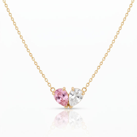 Elora Necklace in gold with a pink and a white birthstone forming a heart