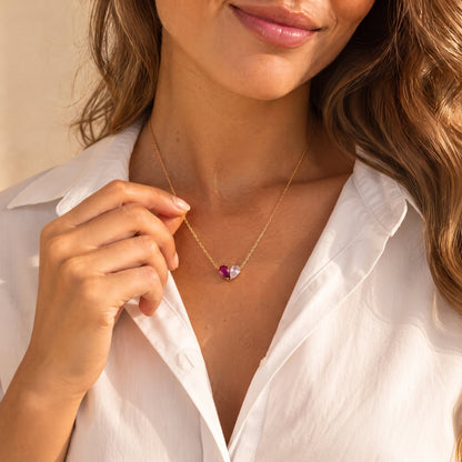 Woman wearing the Elora Necklace with a white shirt