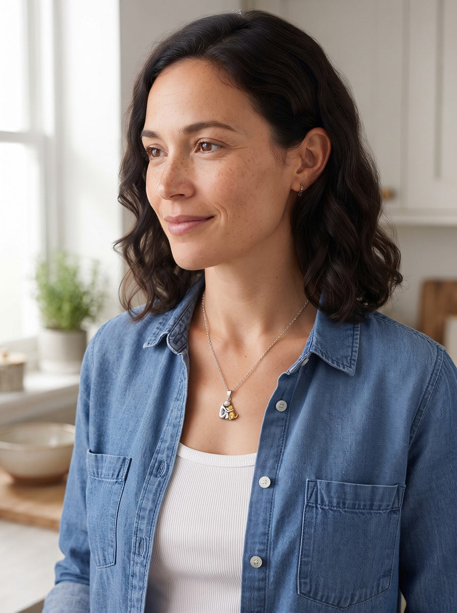 Woman wearing the Eternal Hug Necklace at home