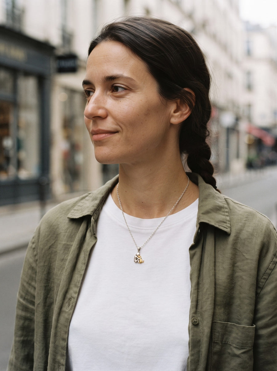 Woman wearing the Eternal Hug Necklace outdoors in the city